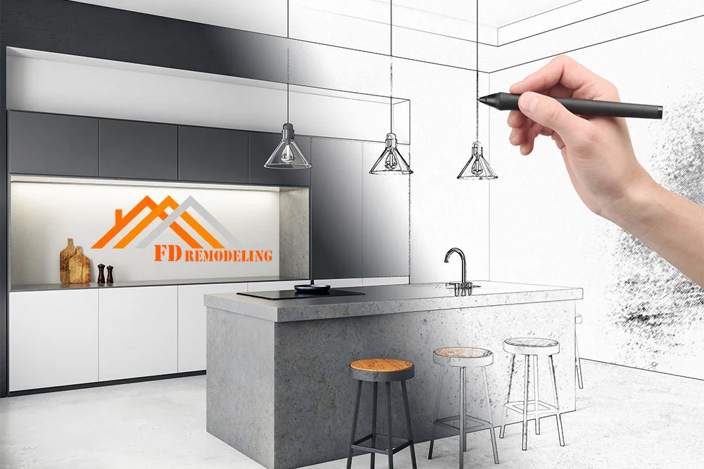 A person is drawing a kitchen design on a piece of paper.