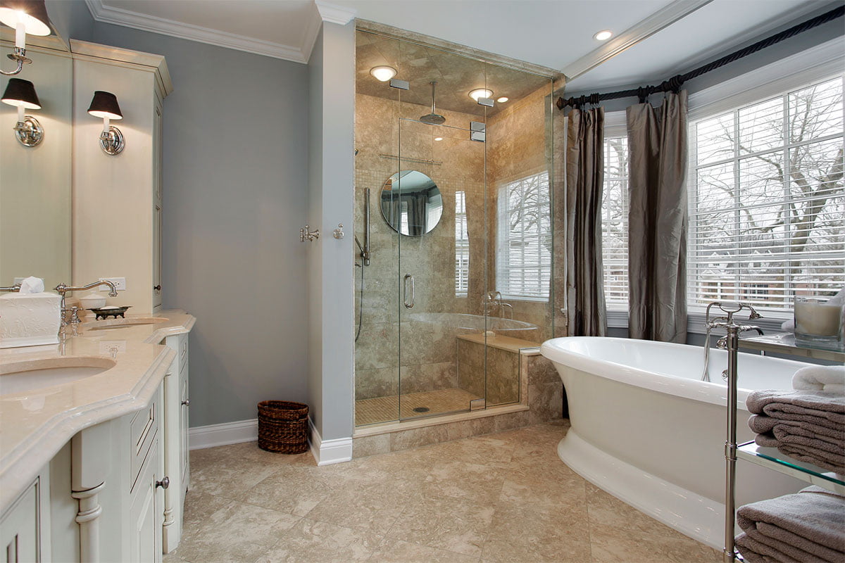 A bathroom with a tub and a sink.