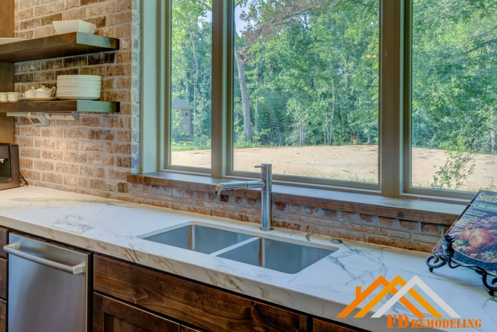 A kitchen with a sink and a window.