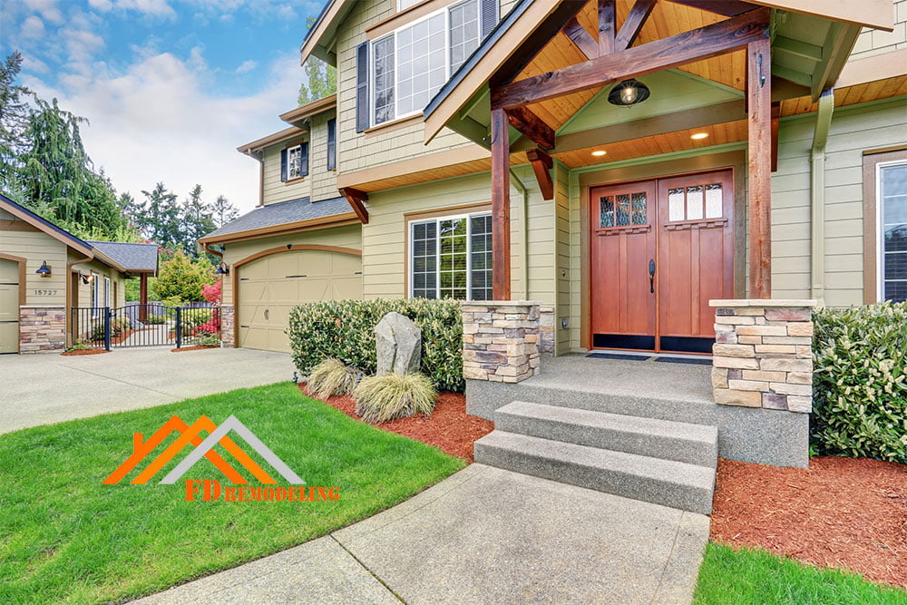 The front of a home with a front door and steps.