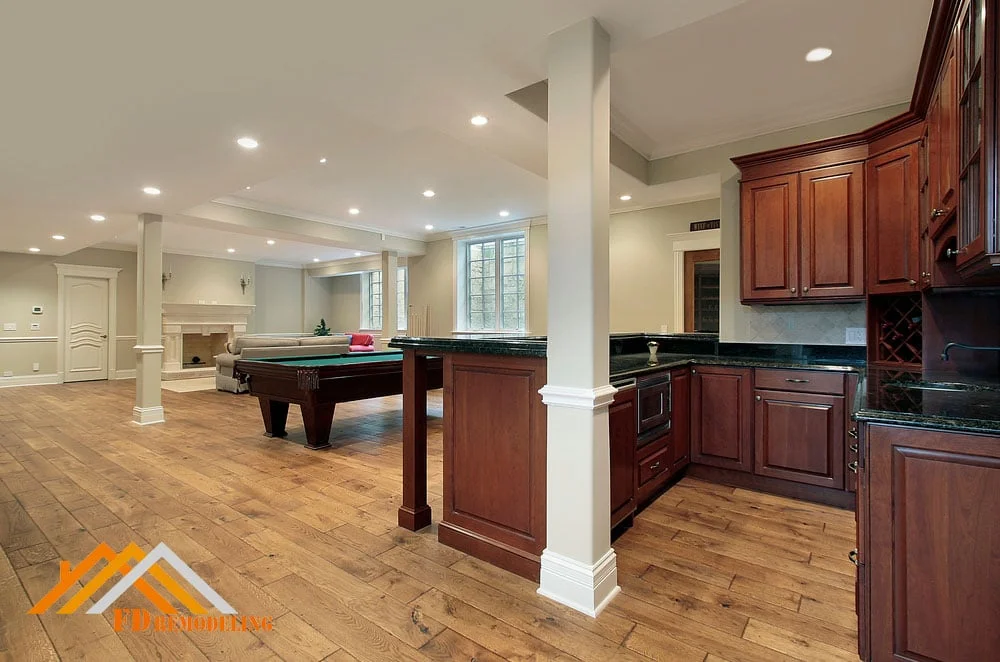 A basement with hardwood floors and a pool table.