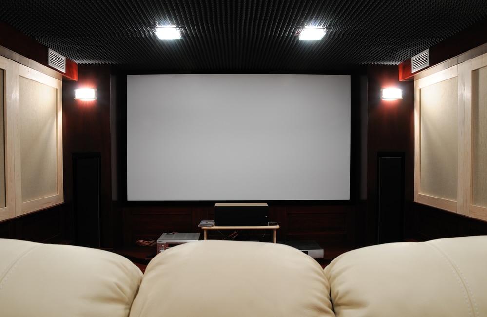 A home theater room with a large screen.