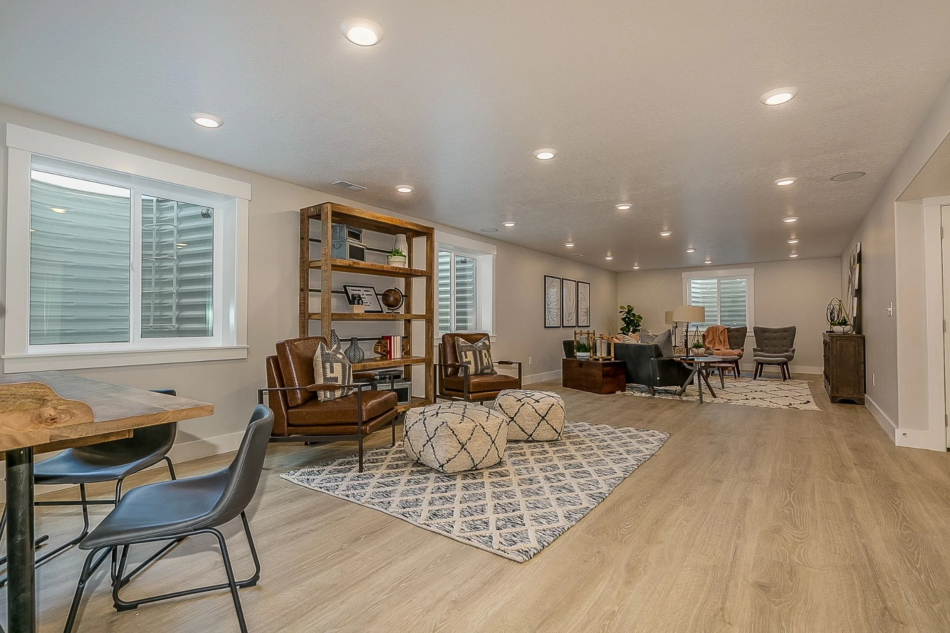 A living room with hardwood floors and a basement Finishing.