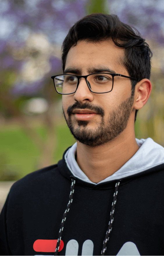 A man wearing glasses and a black hoodie.