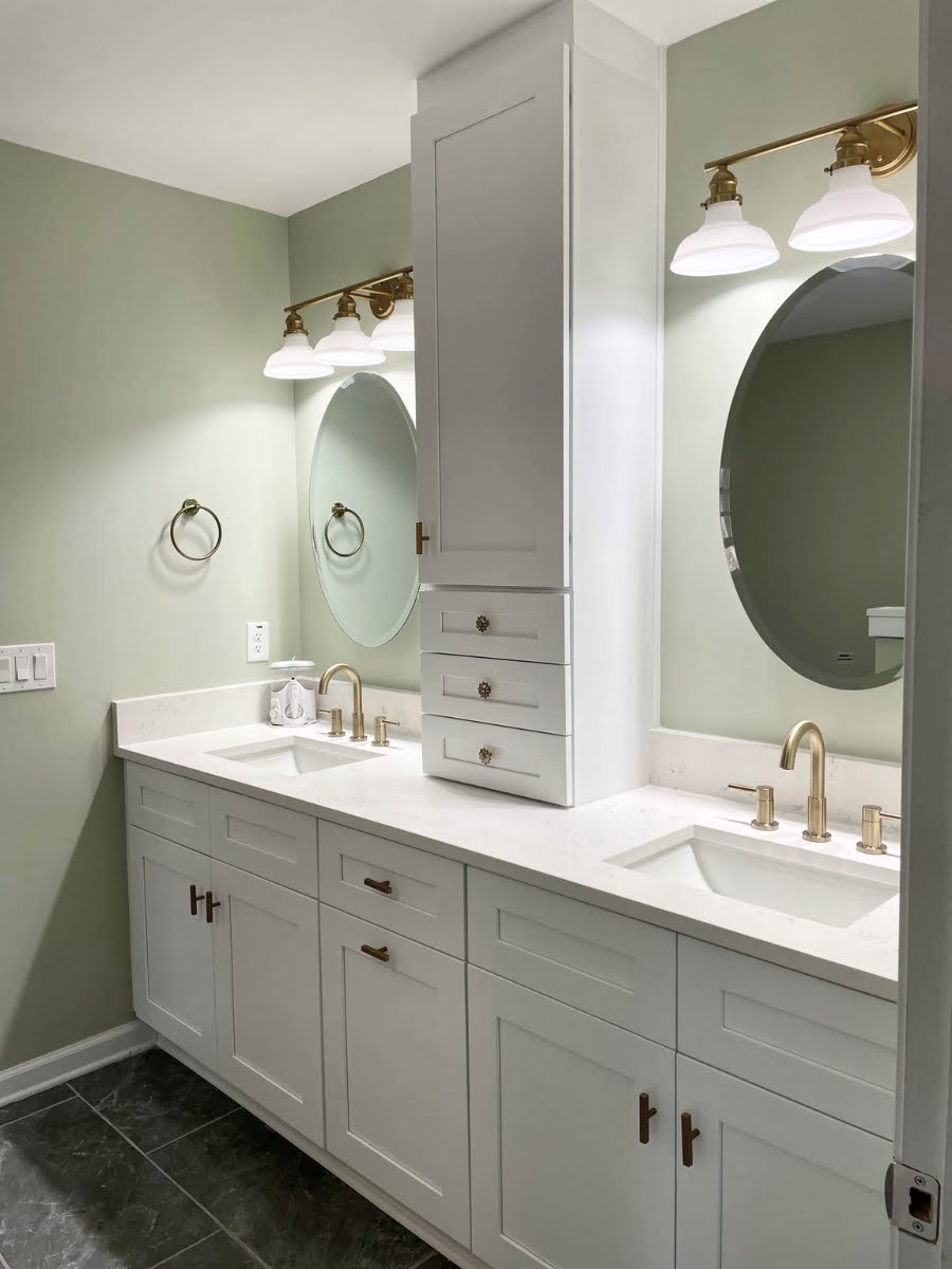 A residential bathroom with two sinks and a mirror undergoing home remodeling services.