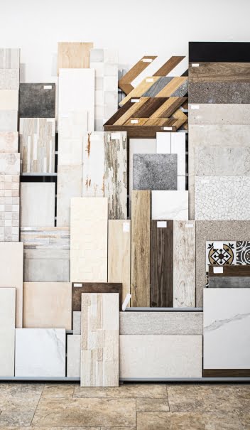 A variety of bathroom tile samples in a commercial store.