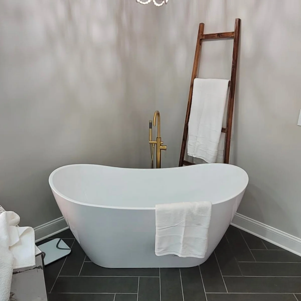 Bathroom Remodeling Services 22 A white bathtub in a bathroom undergoing remodeling.