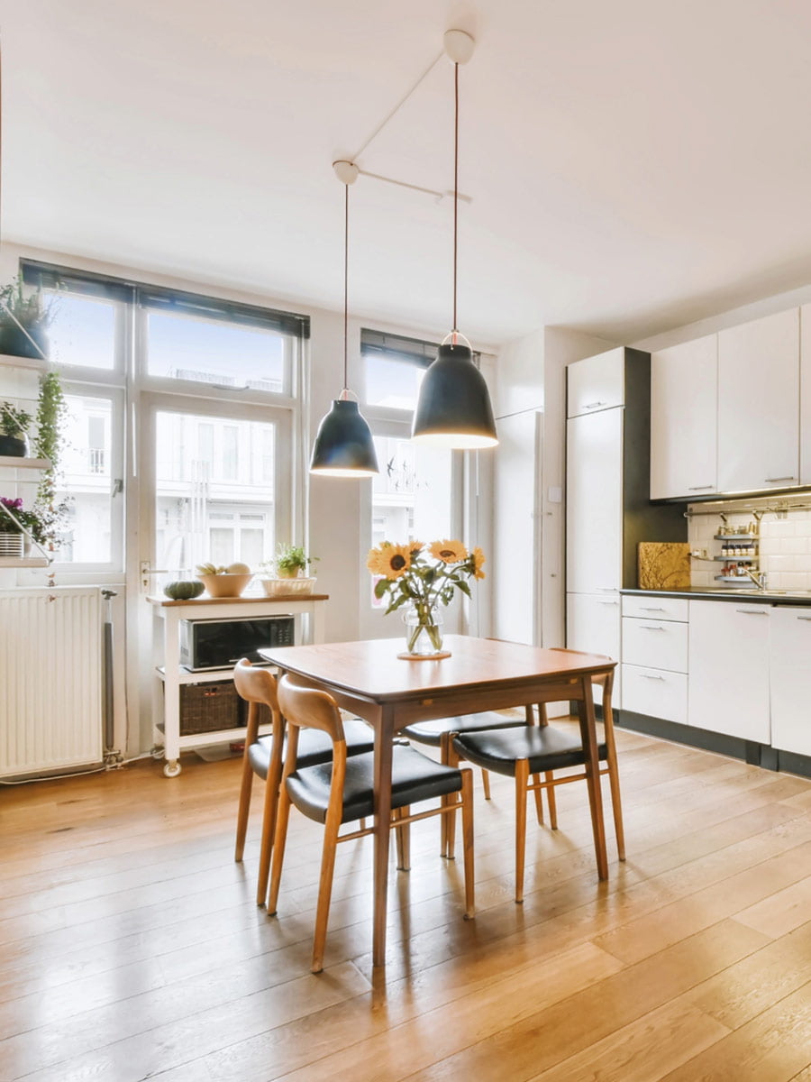 A home with wooden floors and a wooden table.