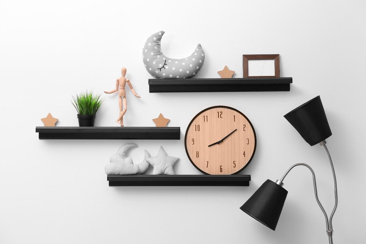 A shelf with a clock and objects on it becomes decorative wall shelves with a clock and objects on them.