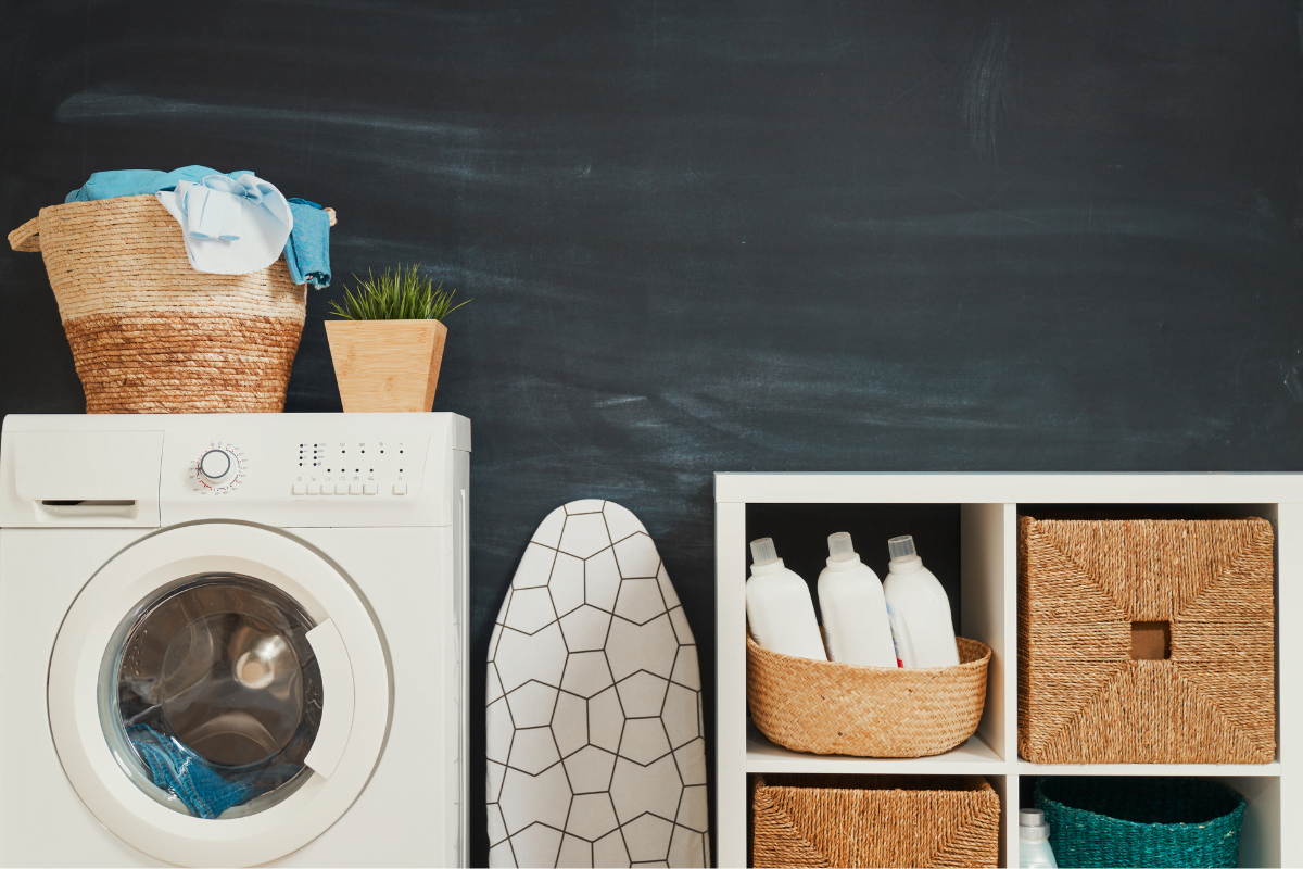 A washing machine and laundry basket.