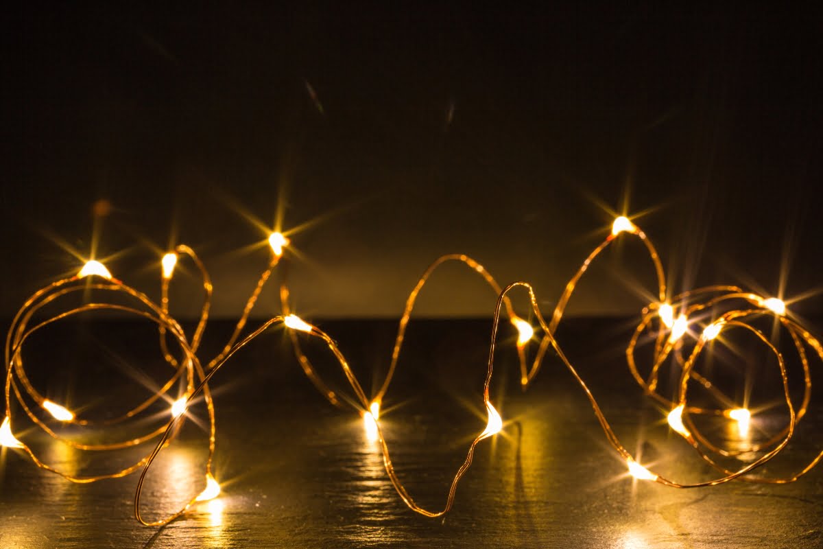 A string of lights on a table adds charm to small living room lighting ideas.