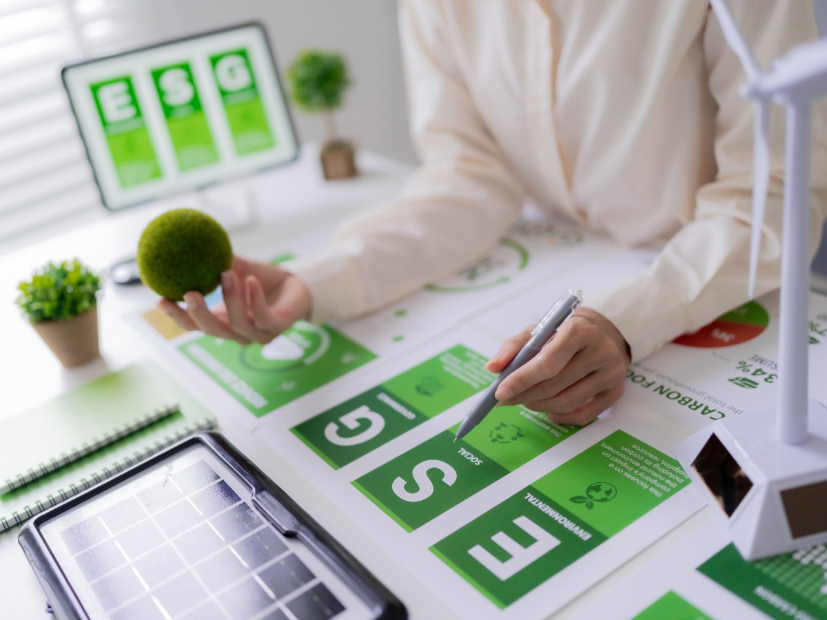 Johns Creek Energy-Efficient Home Remodeling: The Best Green Upgrades for Long-Term Savings 1 A person in Johns Creek holding a ball and a pen, contemplating energy-efficient home remodeling and planning green upgrades.