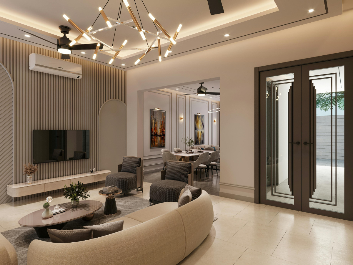 Effective Lighting Design for Home Remodeling 1 Modern living room with neutral tones, contemporary furniture, a wall-mounted TV, striking lighting design, and a view into a dining area through a wide opening.