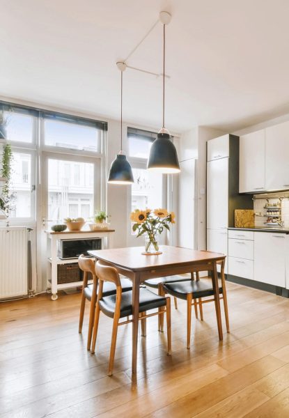 A home with wooden floors and a wooden table. A home with wooden floors and a wooden table.