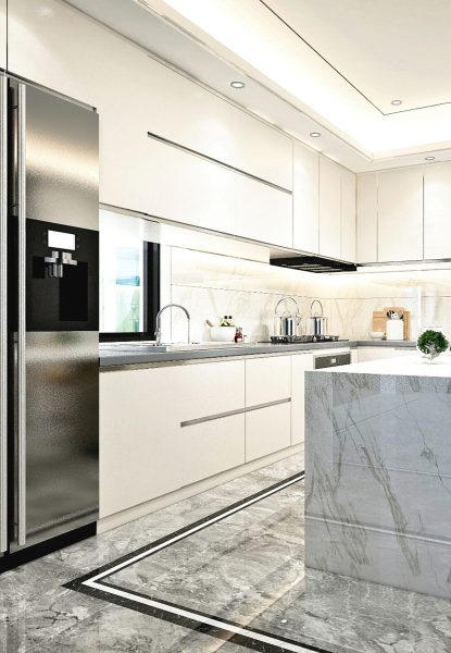 A modern home kitchen with marble counter tops and stainless steel appliances.