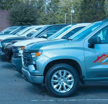 Chevrolet silverado trucks parked in a parking lot.